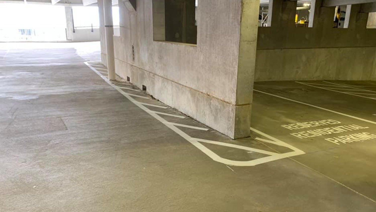 hazard lines around parking garage curb