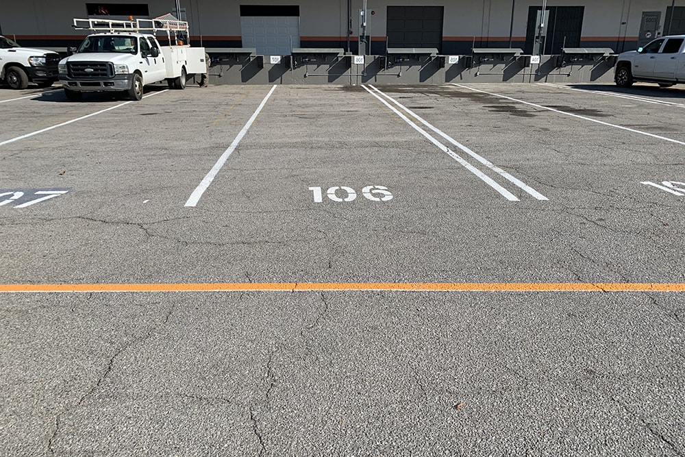 brand new stall lines striped in Amazon’s parking lot