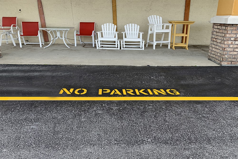 freshly striped “no parking” signage in NC shopping center