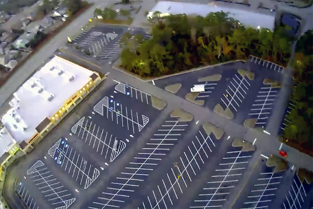 overhead view of freshly striped parking stalls in NC shopping center