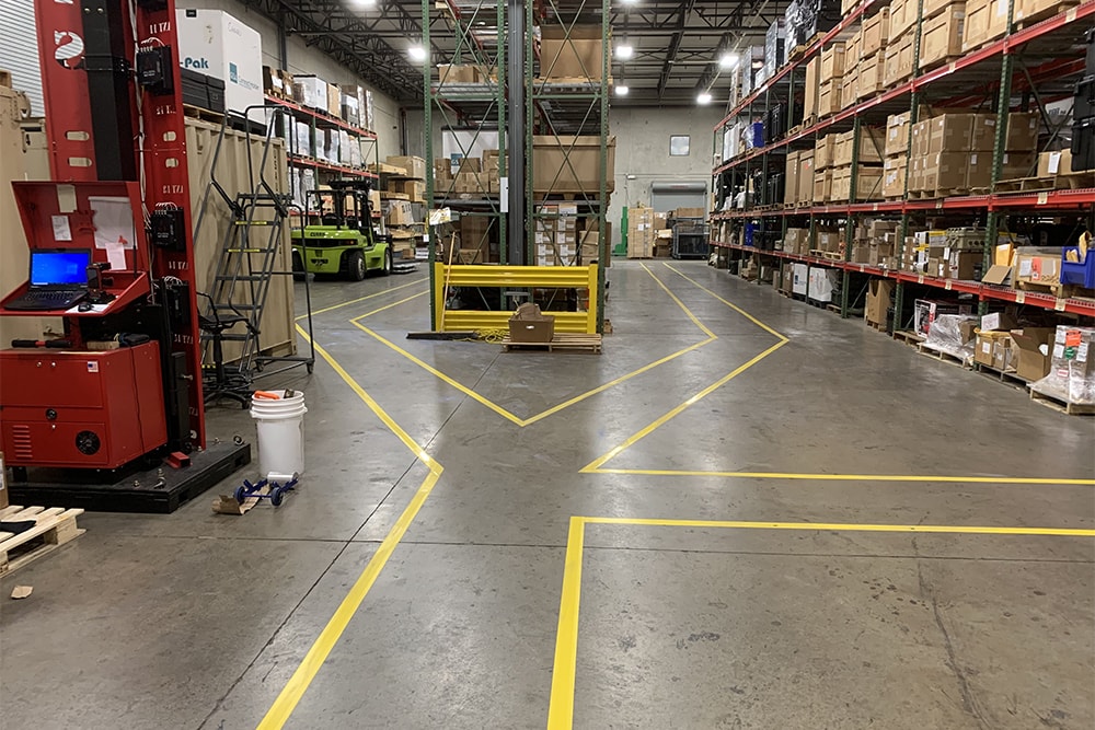 yellow floor markings surrounding warehouse aisles in Madison, AL