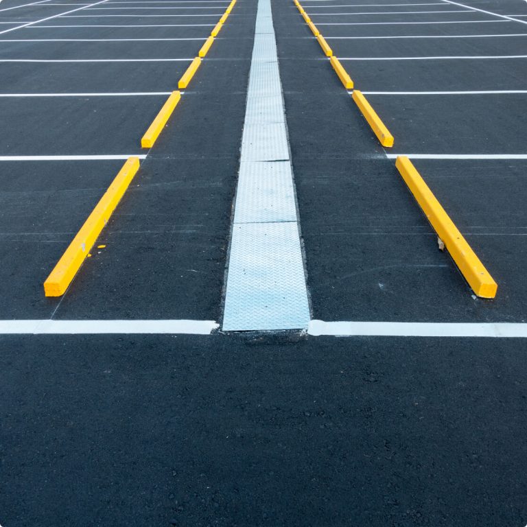 parking lot striping with yellow wheel stops