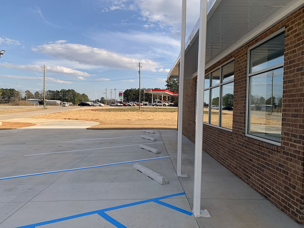 side shot of new parking stalls at Cleburne Pharmacy in Wedowee, AL