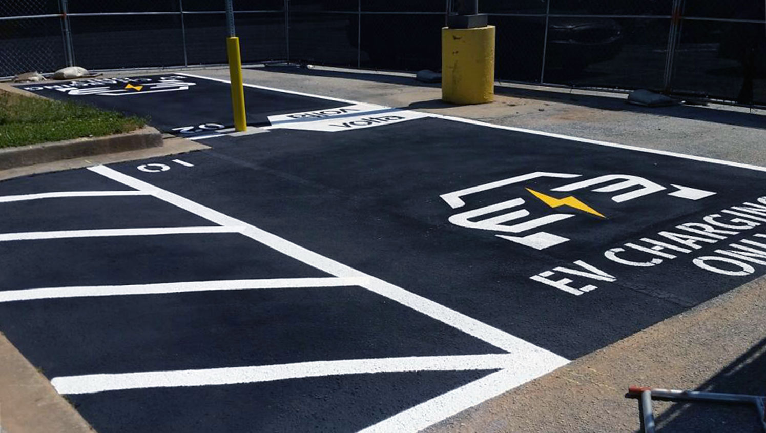 electric vehicle charging only stencils painted in two parking stalls in Atlanta, GA
