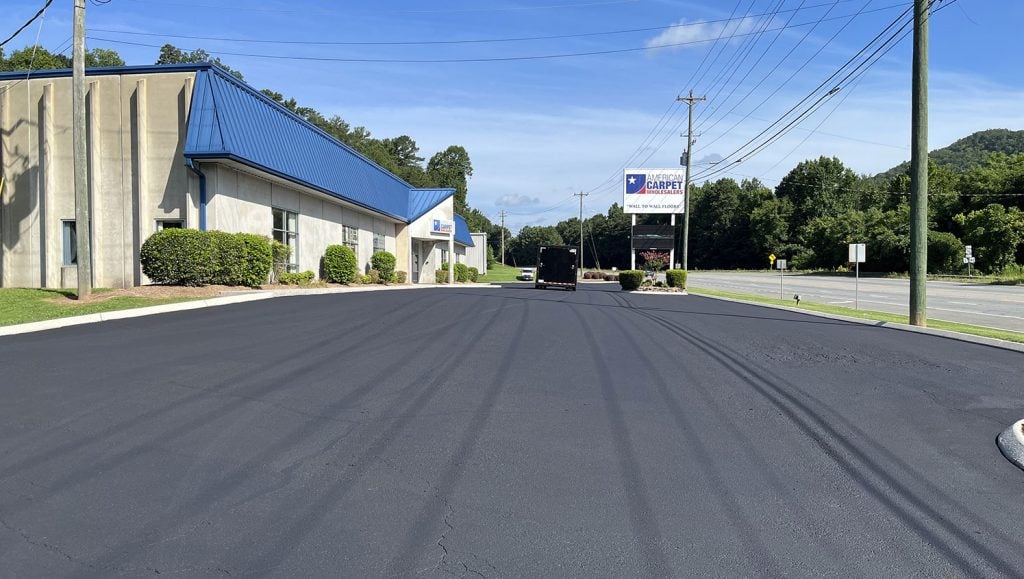 workers sealing asphalt