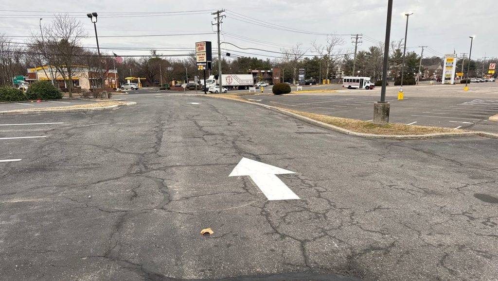 white arrow freshly painted for dollar tree parking lot