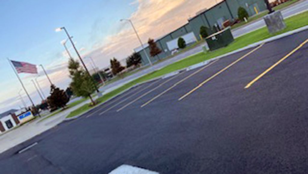 overhead view of striped dental office parking lot