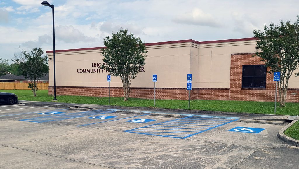 freshly striped parking spaces at a commercial property in Lafayette, LA
