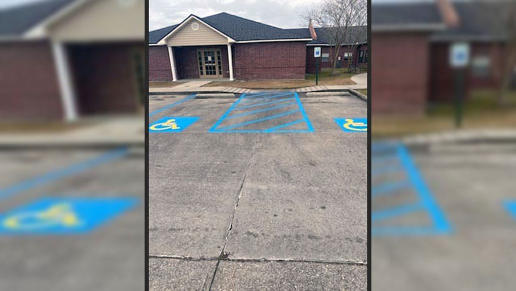 parking lot with freshly striped ADA compliant stalls