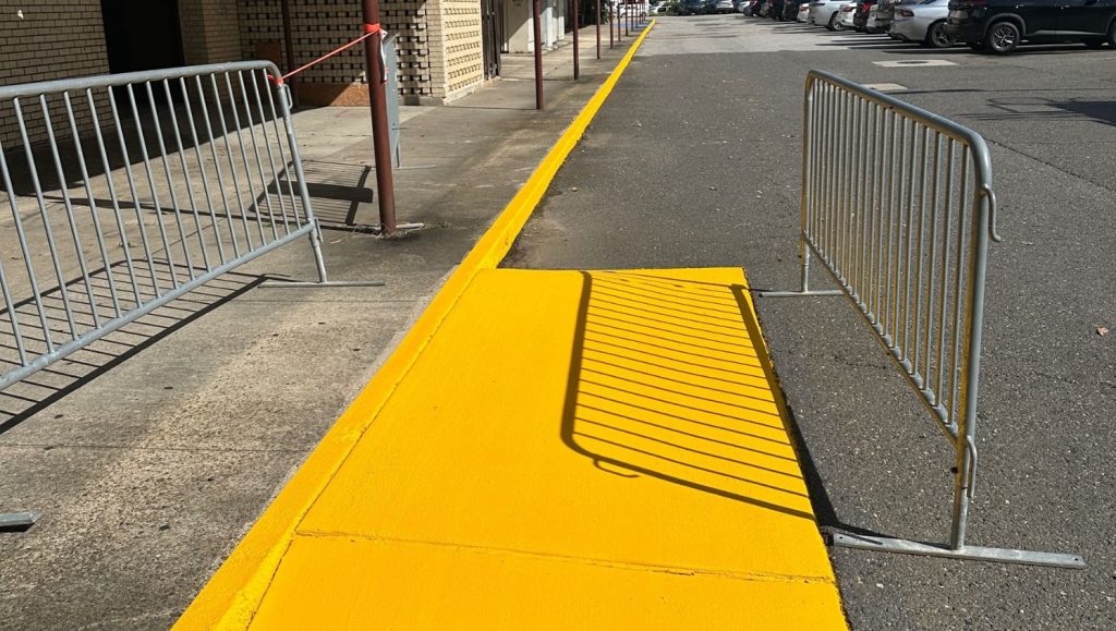 close-up of yellow paint freshly painted for Heymann Performing Arts Center