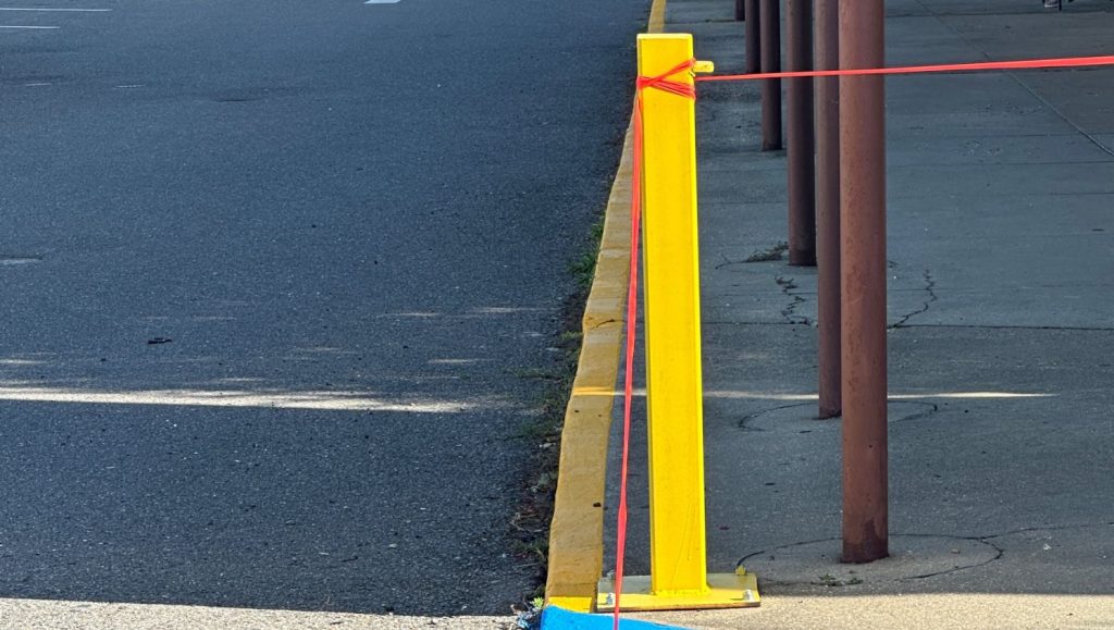 post freshly painted for Heymann Performing Arts Center parking lot