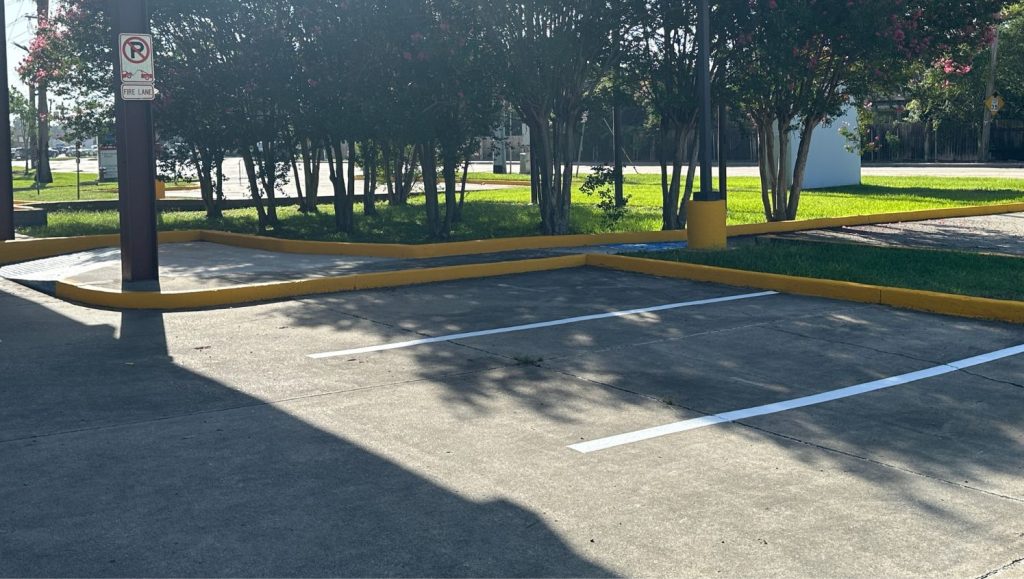 parking spots freshly painted for Heymann Performing Arts Center parking lot