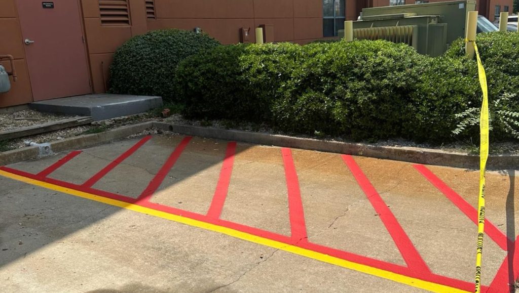 red line markings freshly painted for Extended Stay America