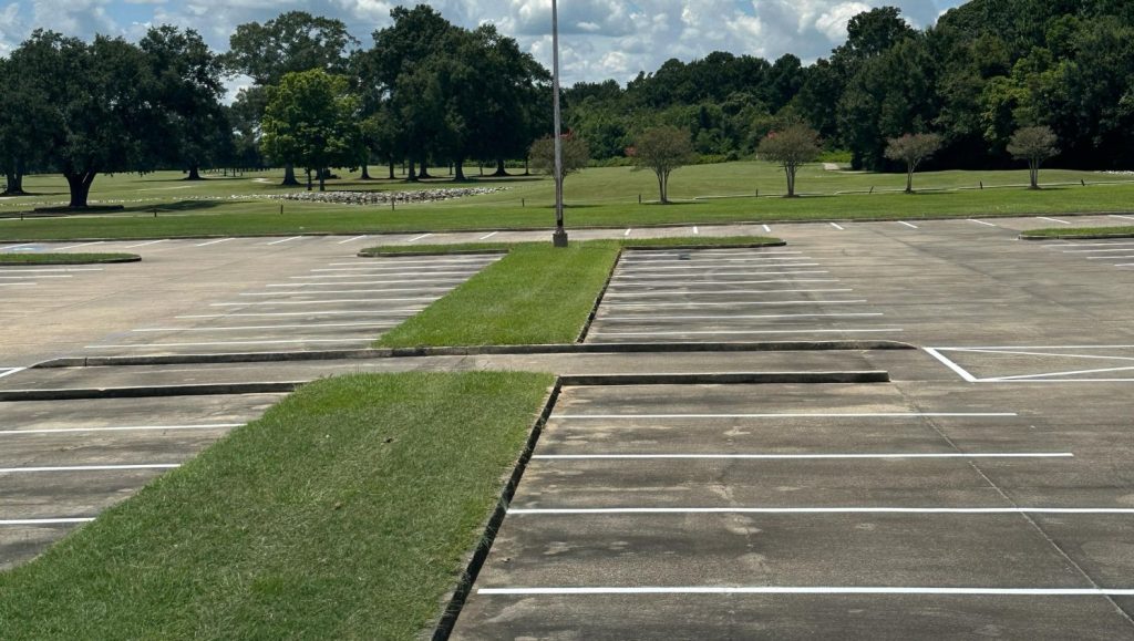close-up of Les Vieux Chenes Golf Course parking lot with freshly painted parking spots