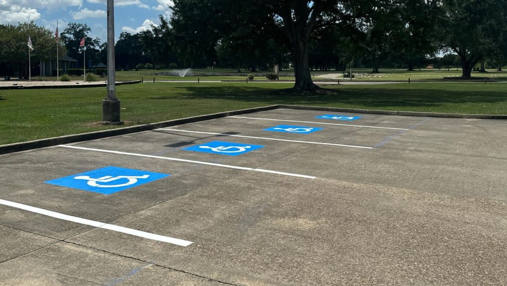 close-up of ada compliance parking spots freshly painted for Les Vieux Chenes Golf Course