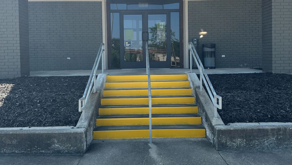 Regions Bank stairs freshly painted yellow