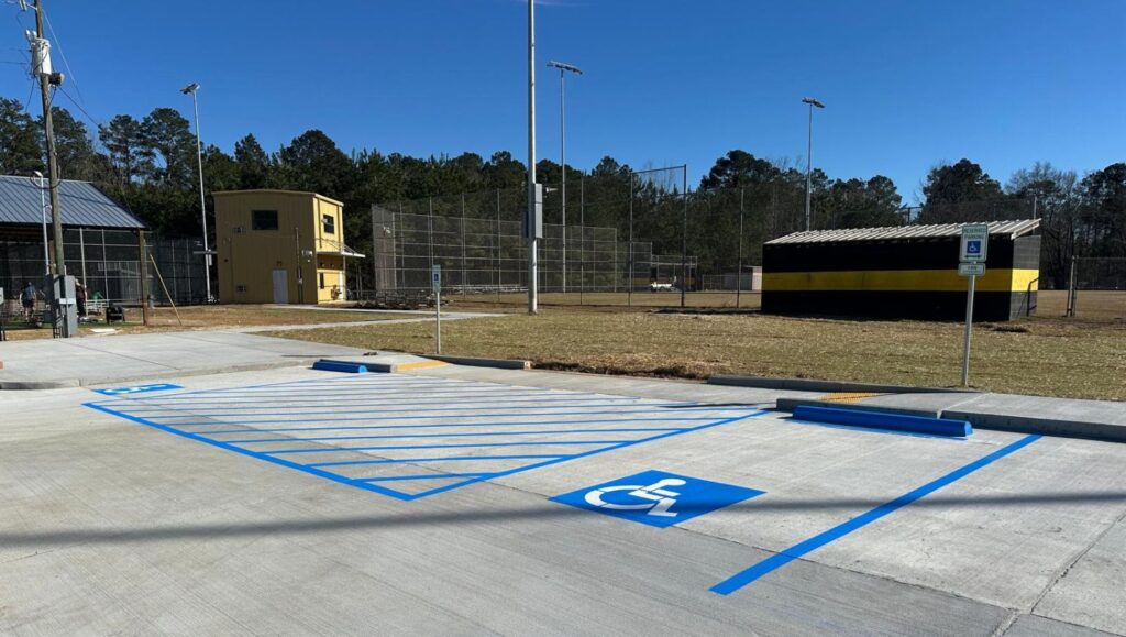 ada compliance parking spots freshly painted for Dodson High School parking lot