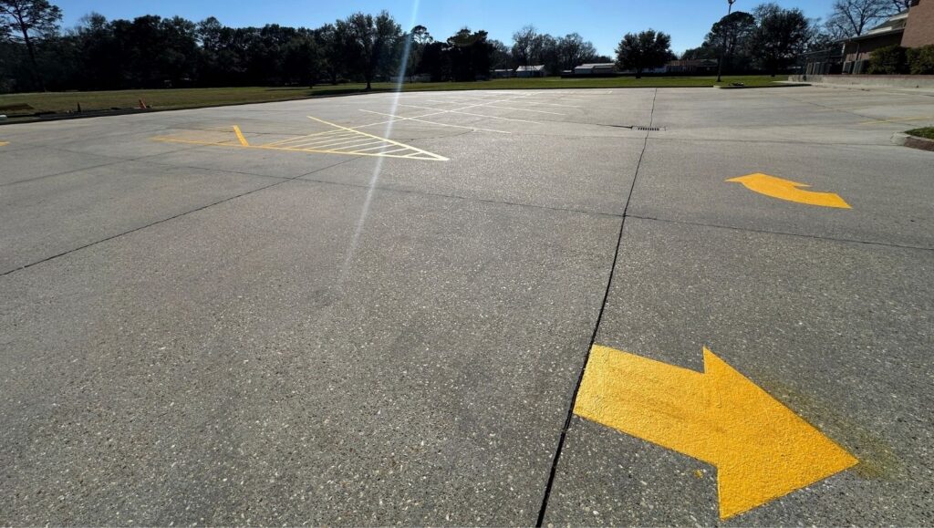 yellow arrows freshly painted for St. Joseph Catholic Church parking lot