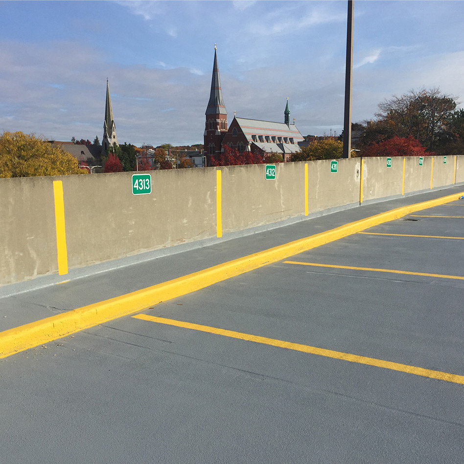 Freshly painted parking stalls and pavement markings in Manchester, NH