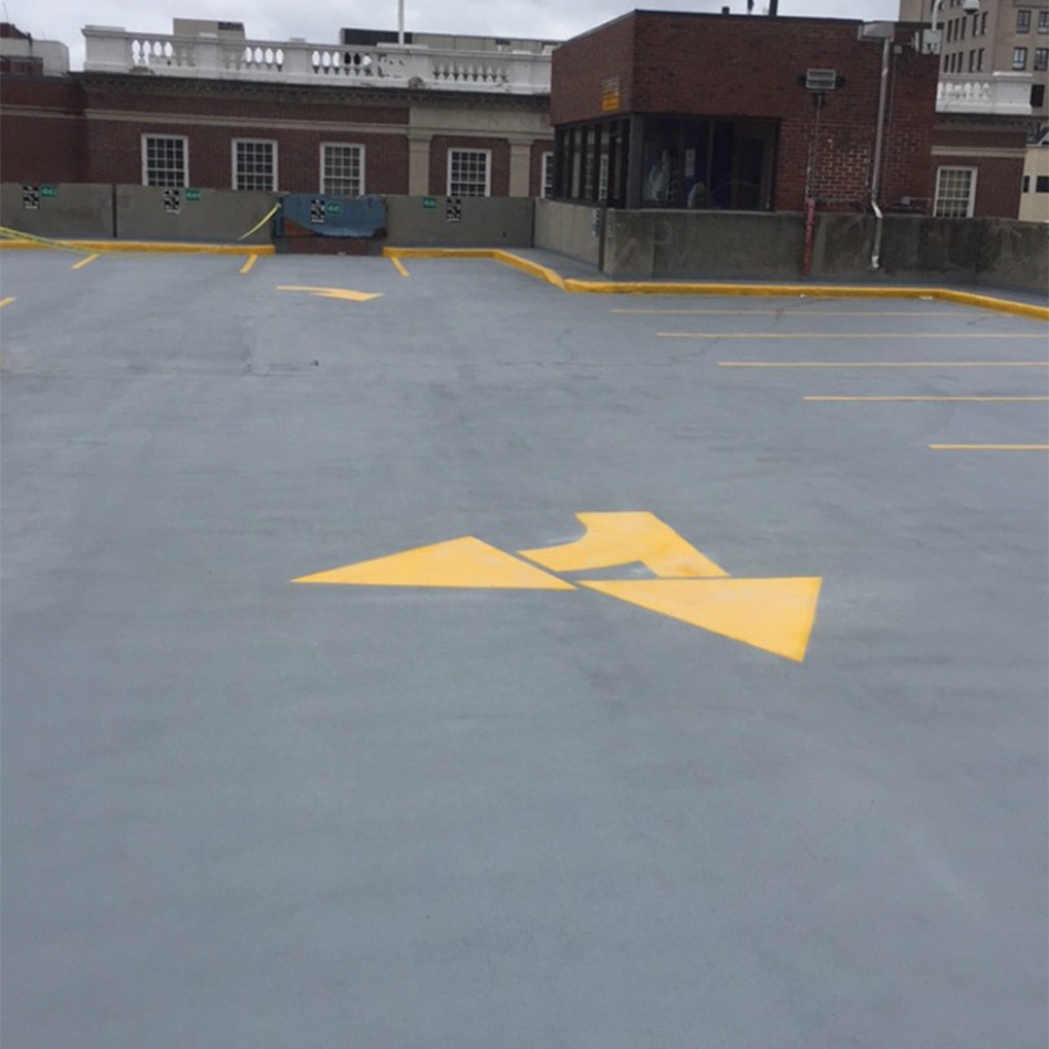 Freshly painted pavement markings in Manchester, NH parking lot