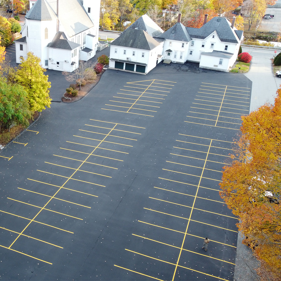 overhead view of a freshly striped parking lot at St. Patrick’s church in Milford, NH