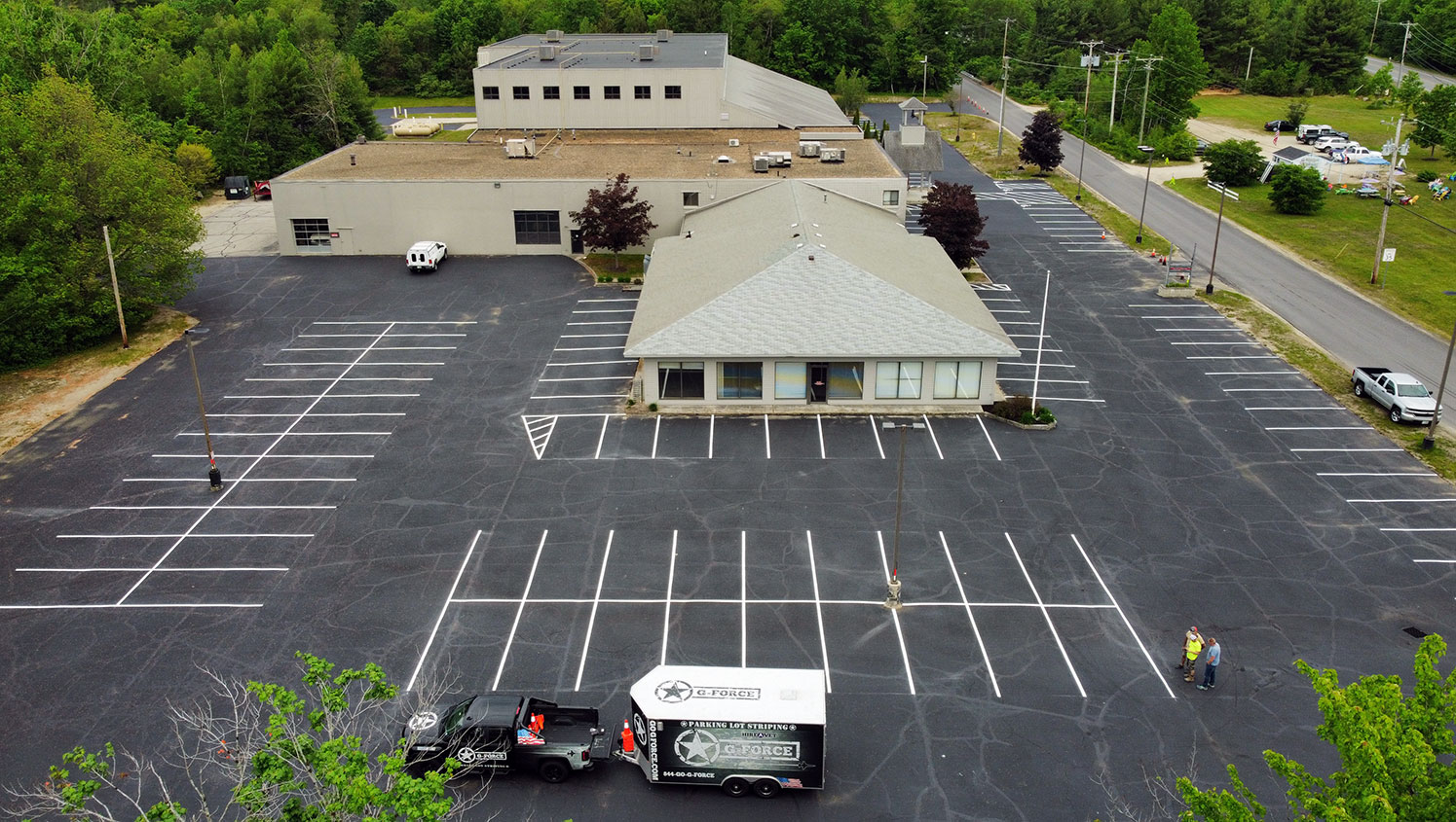aerial view of new parking stalls striped at Blackdog Sealcoating in Peterborough, NH