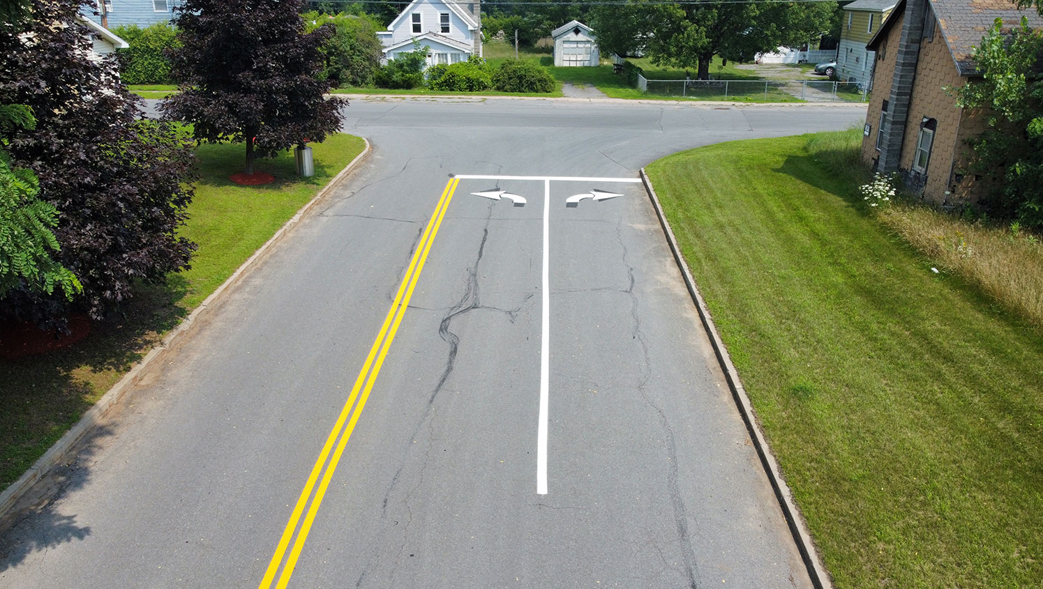 freshly striped driveway line and directional arrows