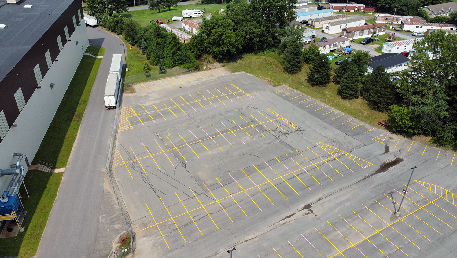 new parking stalls striped in transportation facility parking lot