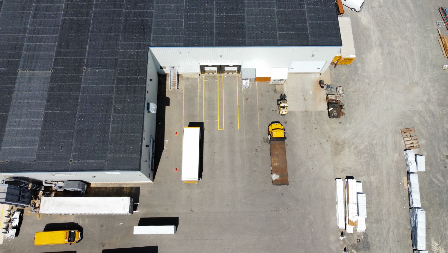an aerial view of trucks in the loading zone