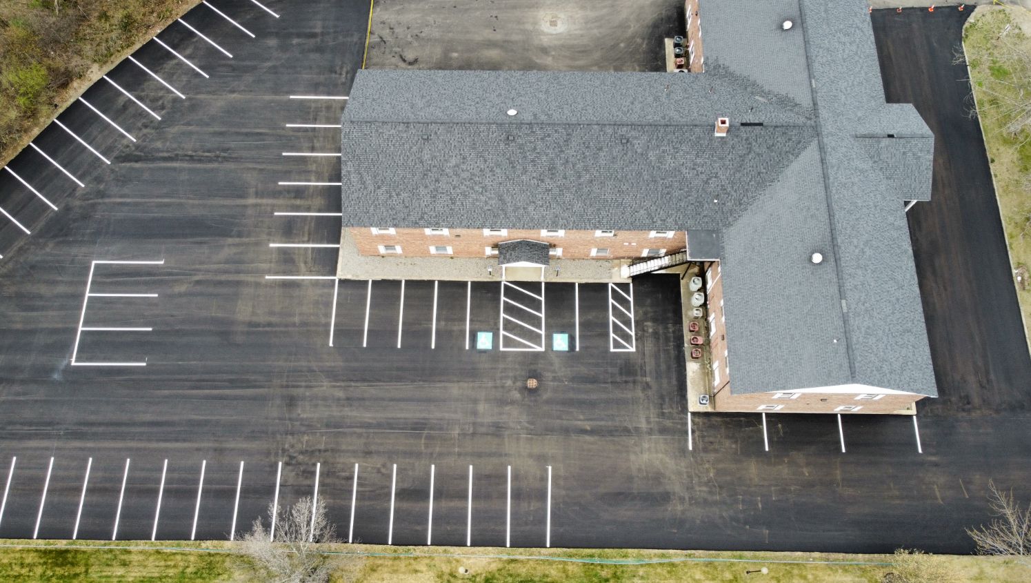 an aerial view of white line stripings on lot