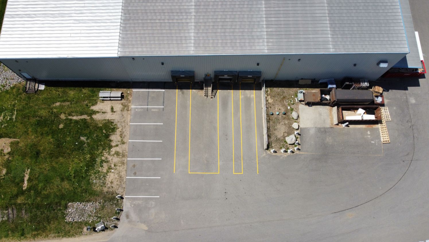 an aerial view of yellow loading dock lines