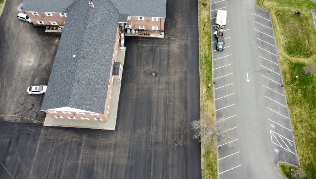 an aerial view of white line stripings on lot
