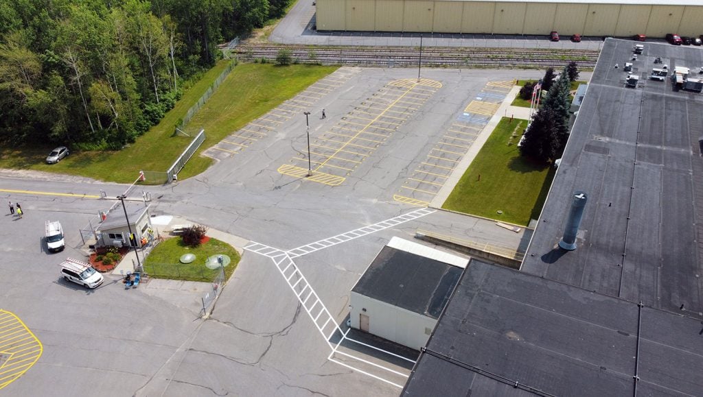newly marked parking lot spaces and walkways