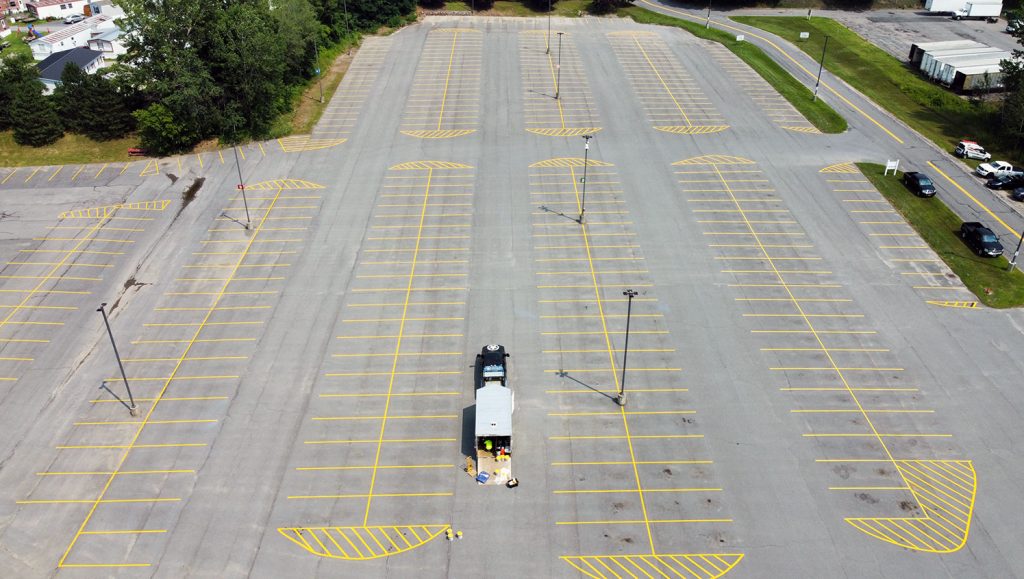 freshly striped driveway line and directional arrows
