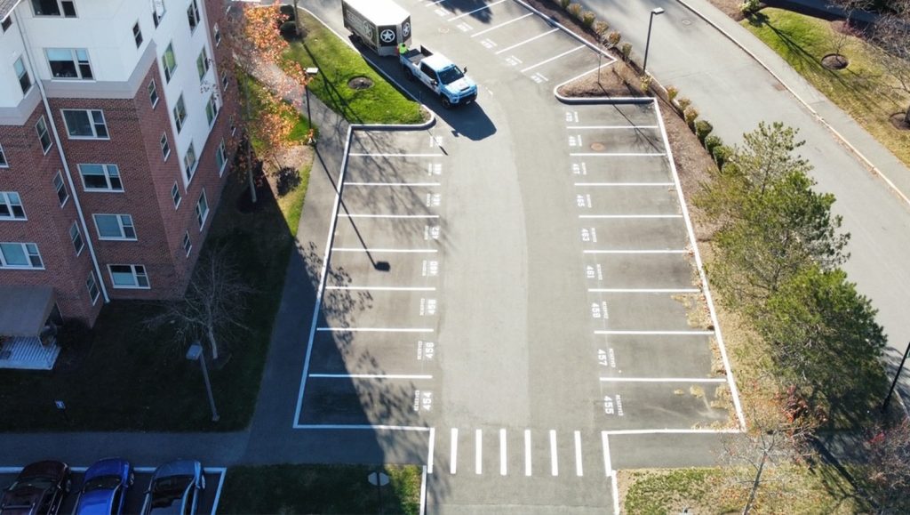 freshly painted parking spots for Brooksby Village parking lot