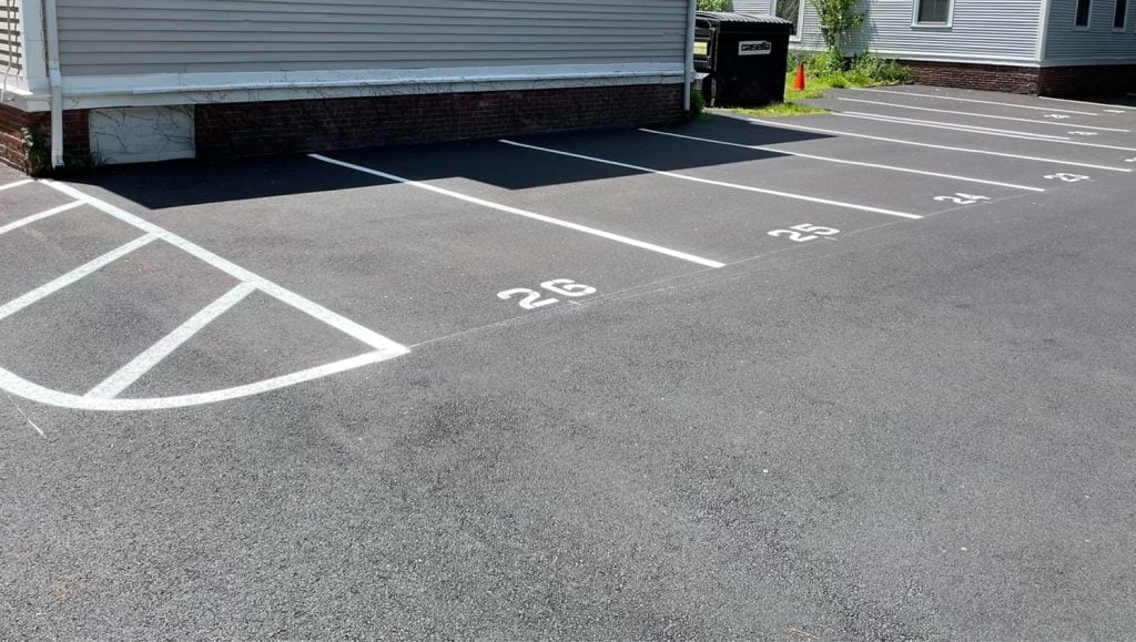 close-up of freshly painted parking spots for EJ Paving parking lot