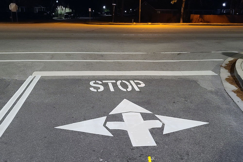 new stop bar and traffic arrow at lidl grocery store