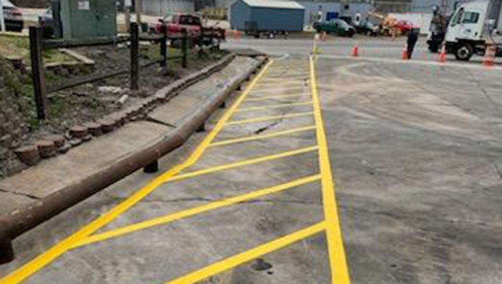 cones on top of re-striped safety lane markings