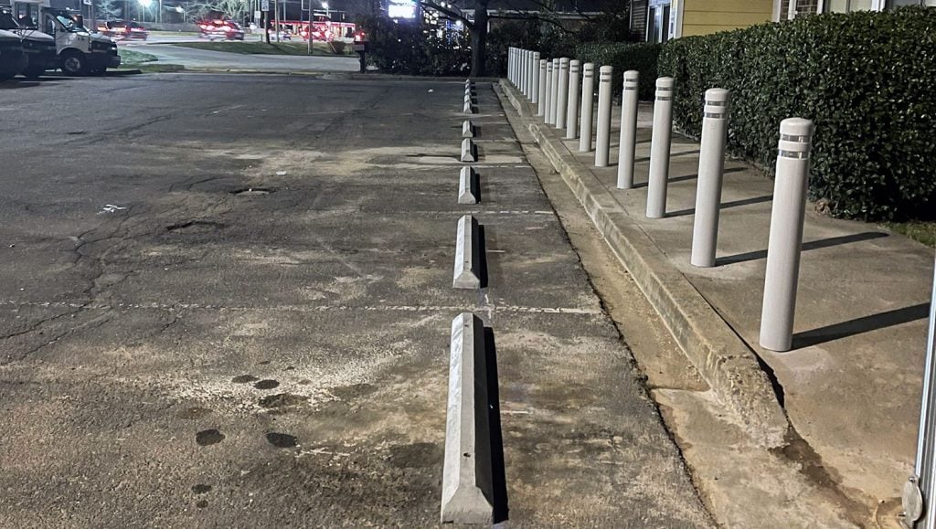 parking stop installation at la petite academy in shelby