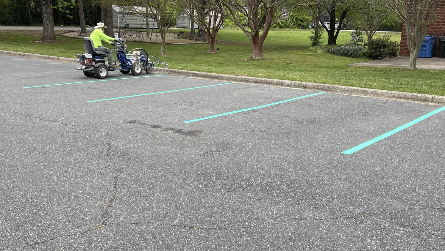crew re-striping a parking stall at mint hill baptist church
