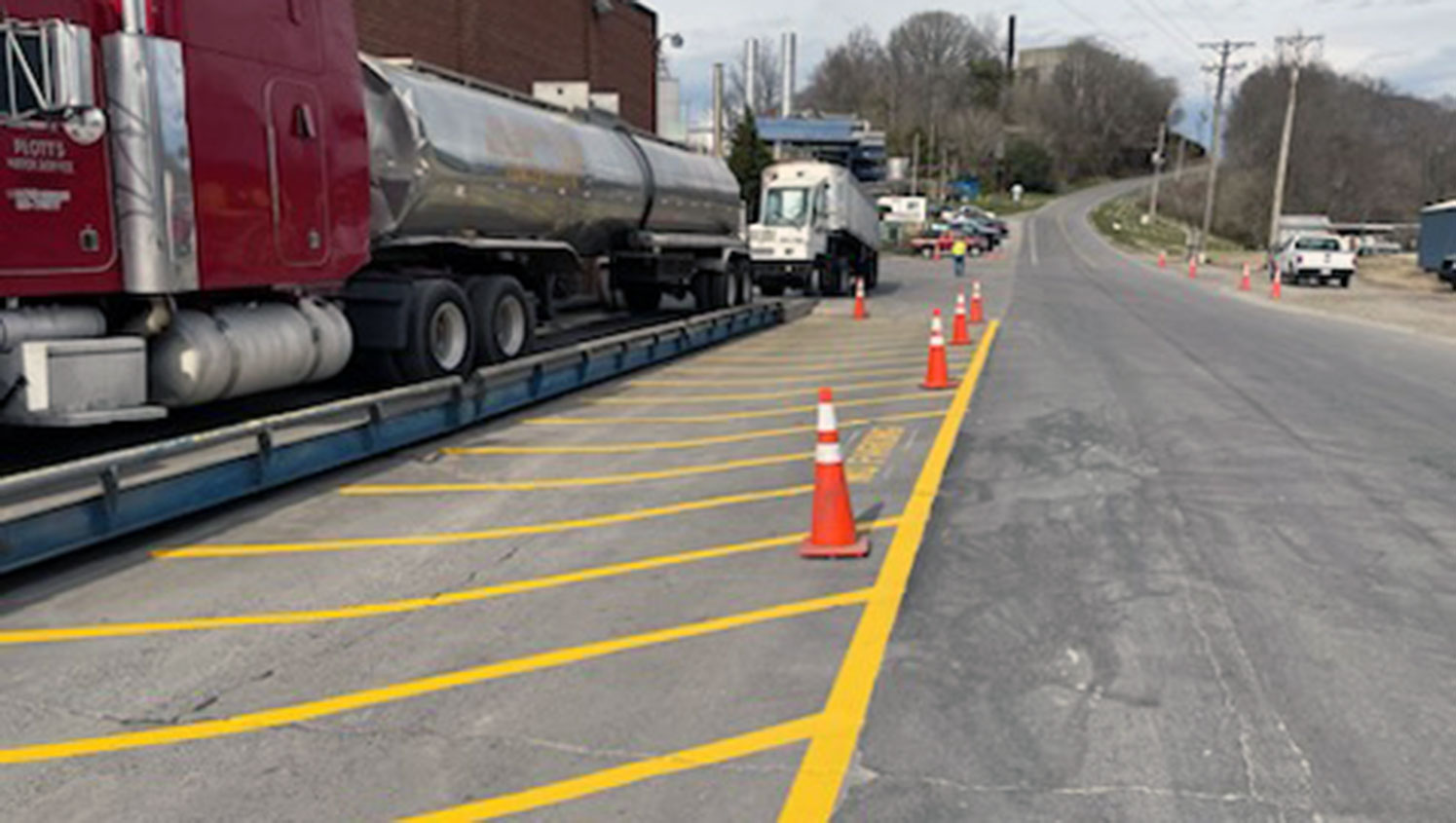 cones on top of re-striped safety lane markings