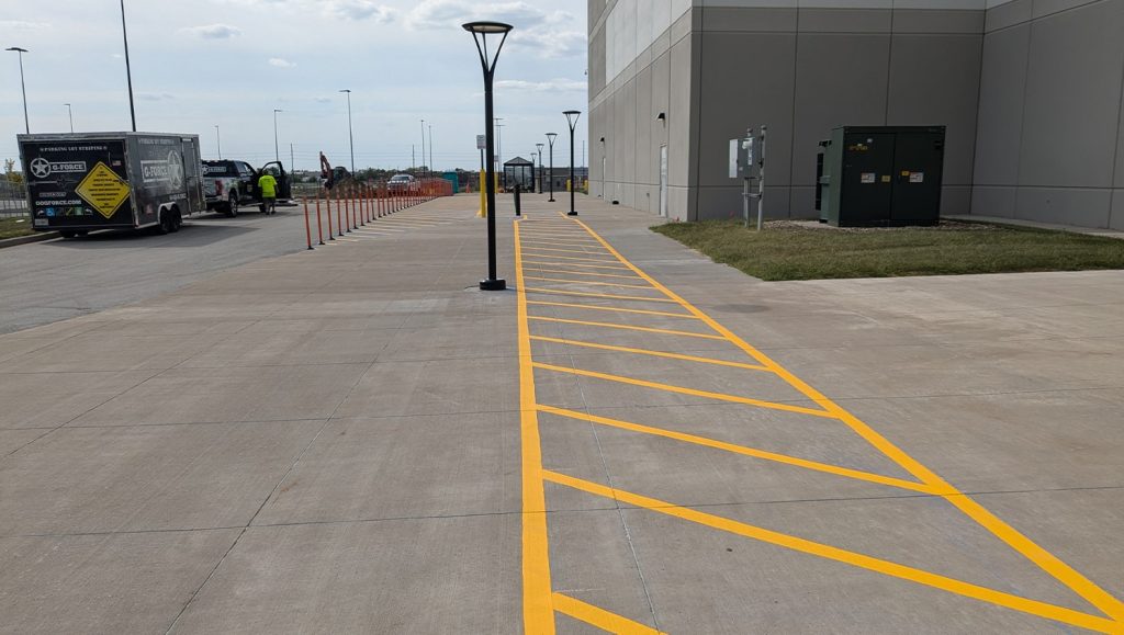 close-up of yellow line striping freshly painted for Amazon