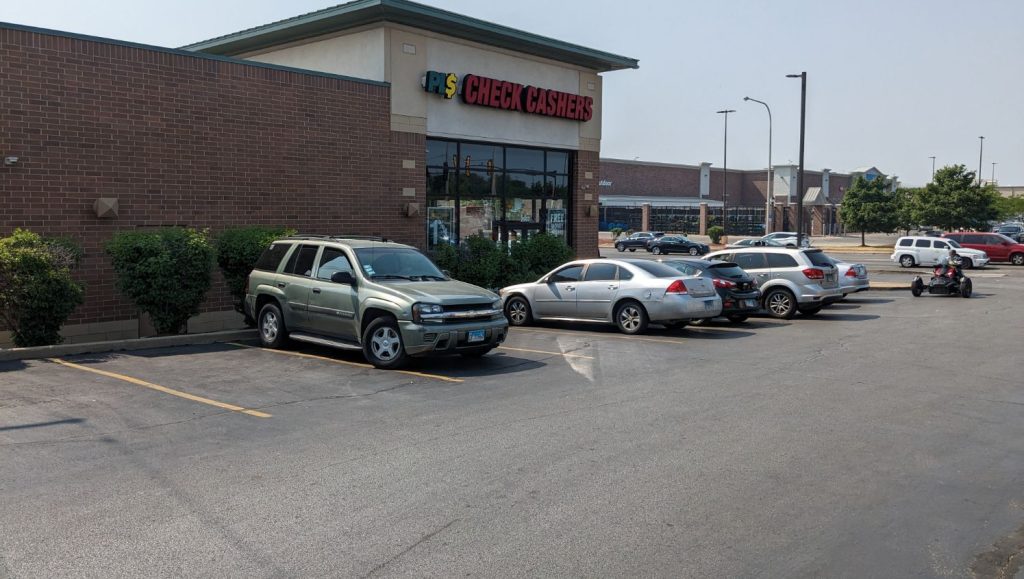 cars parked in re-striped parking lot stalls