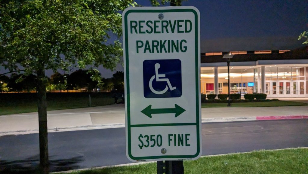 worn handicapped parking spaces awaiting repainting