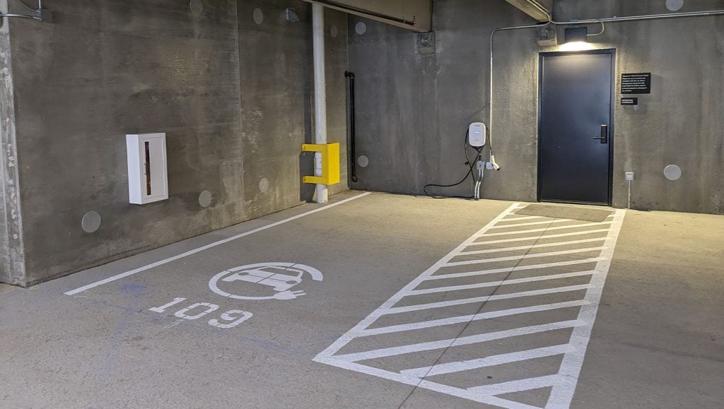 Luxury Apartment Building parking garage with freshly painted ev charging markings