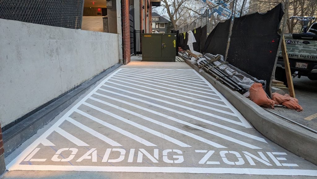loading zone freshly painted for Luxury Apartment Building parking lot