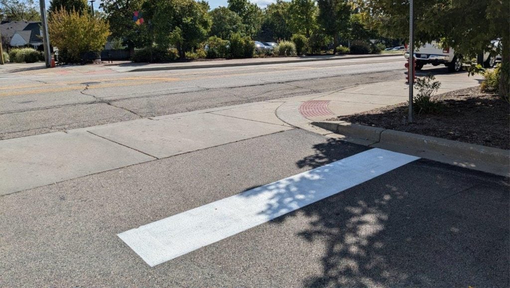 freshly painted white line markings for DMG Management Matters - Residential parking lot