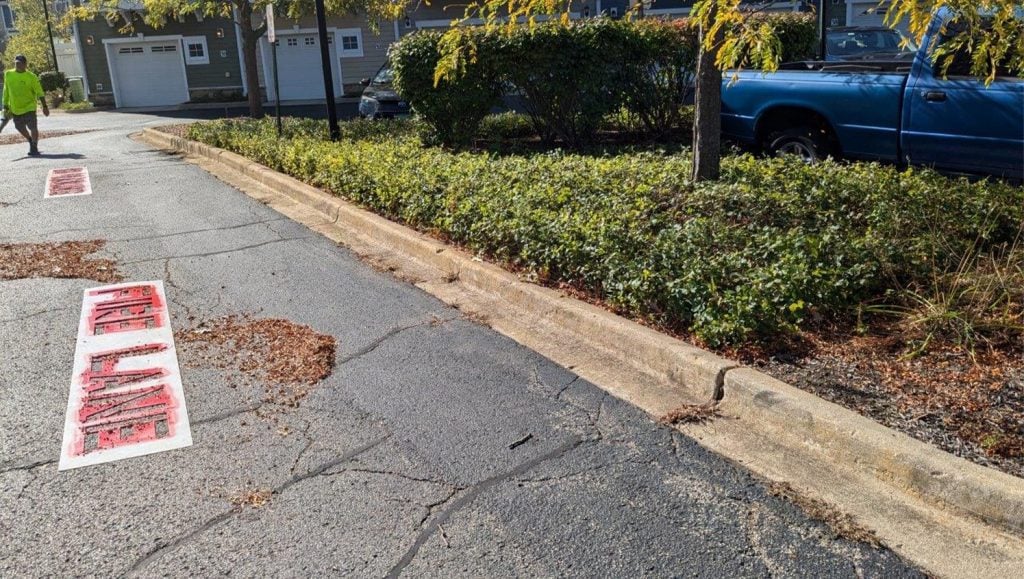 fire lane markings freshly painted for DMG Management Matters - Residential parking lot