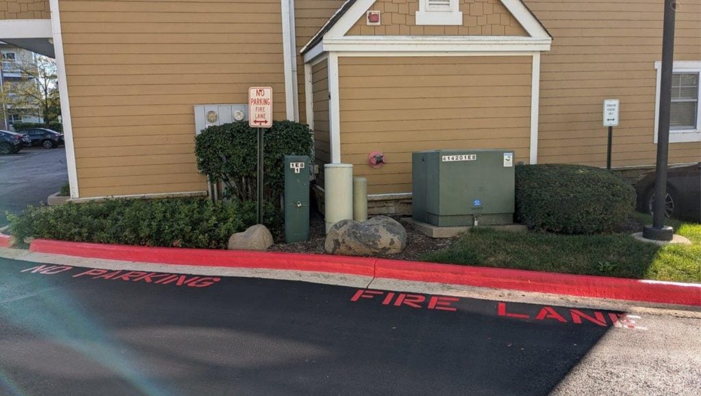fire lane markings freshly painted on curb for DMG Management Matters - Residential