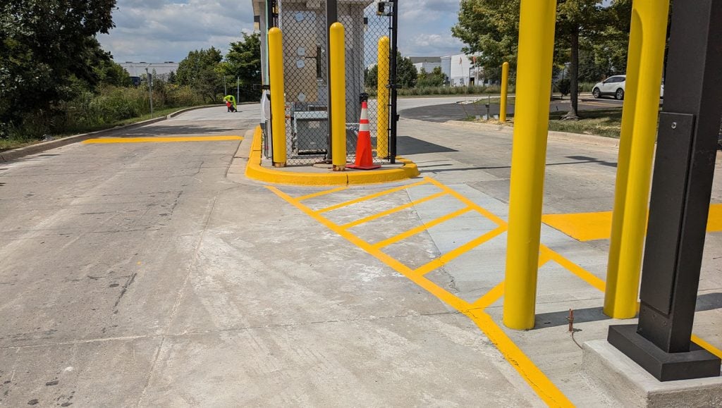 close-up of freshly painted line striping for FedEx Ground